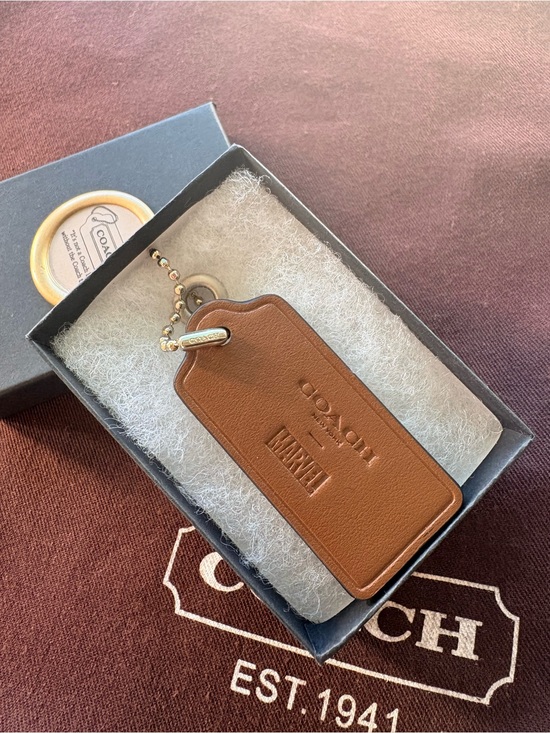 Coach Handbags - 🦸‍♀️ Coach x MARVEL Ltd Ed Saddle Brown Leather HangTag Bag Charm | 2.375”